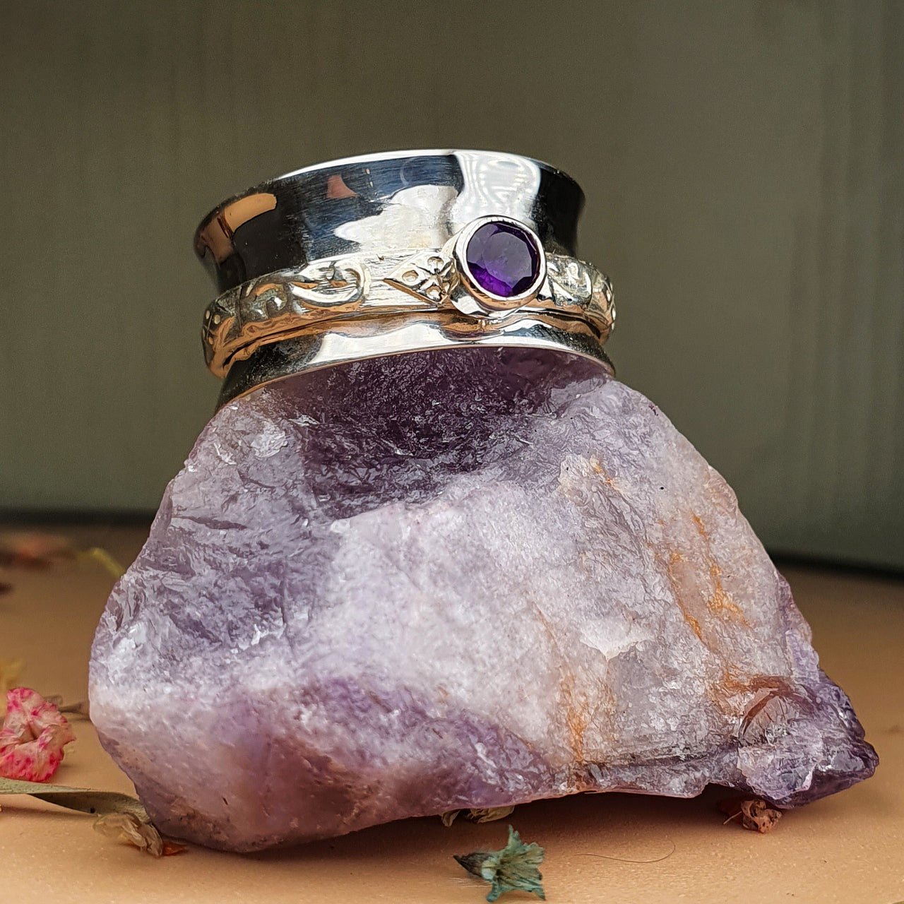 purple tourmaline spinner ring on raw gemstone