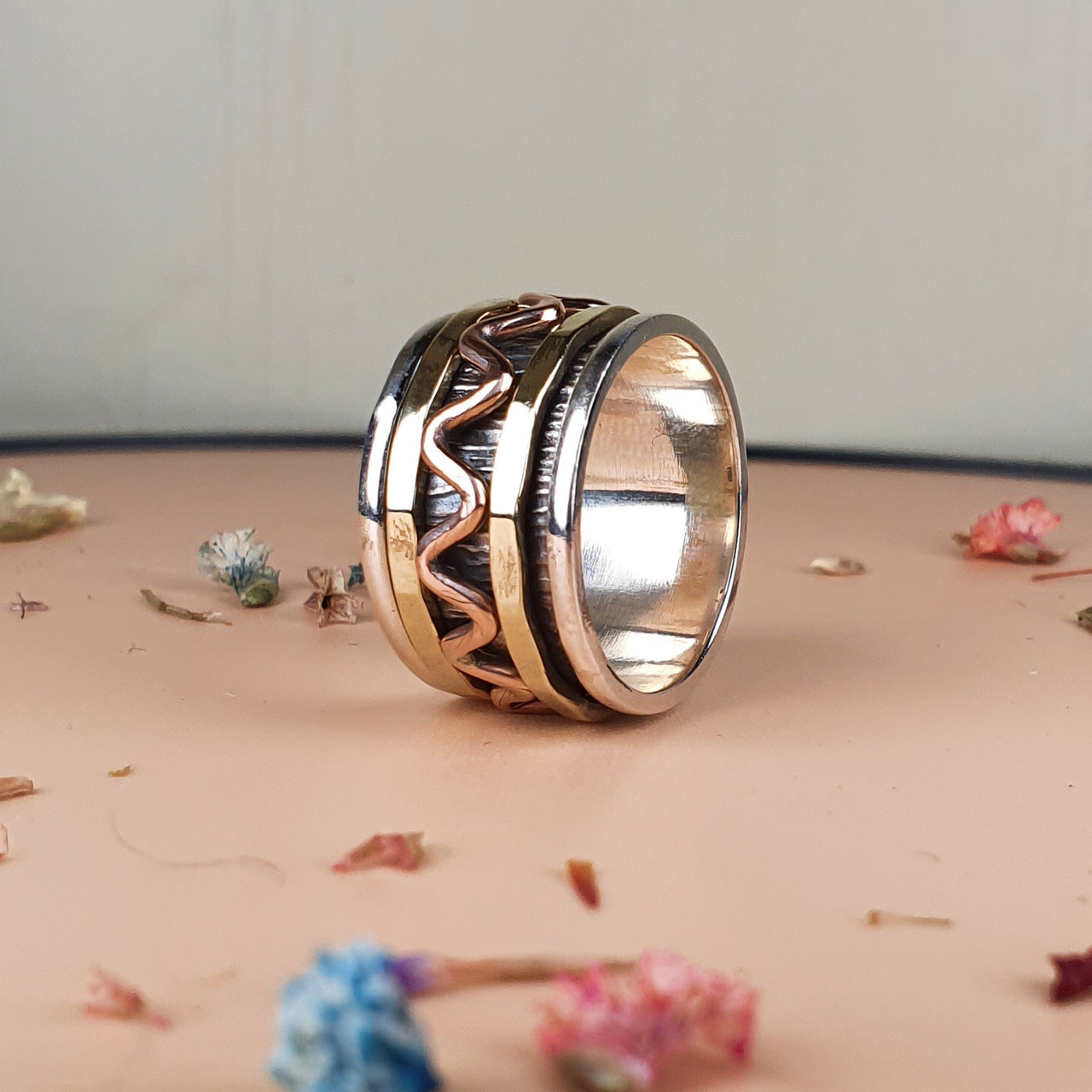 spinner ring with copper and brass spinning rings