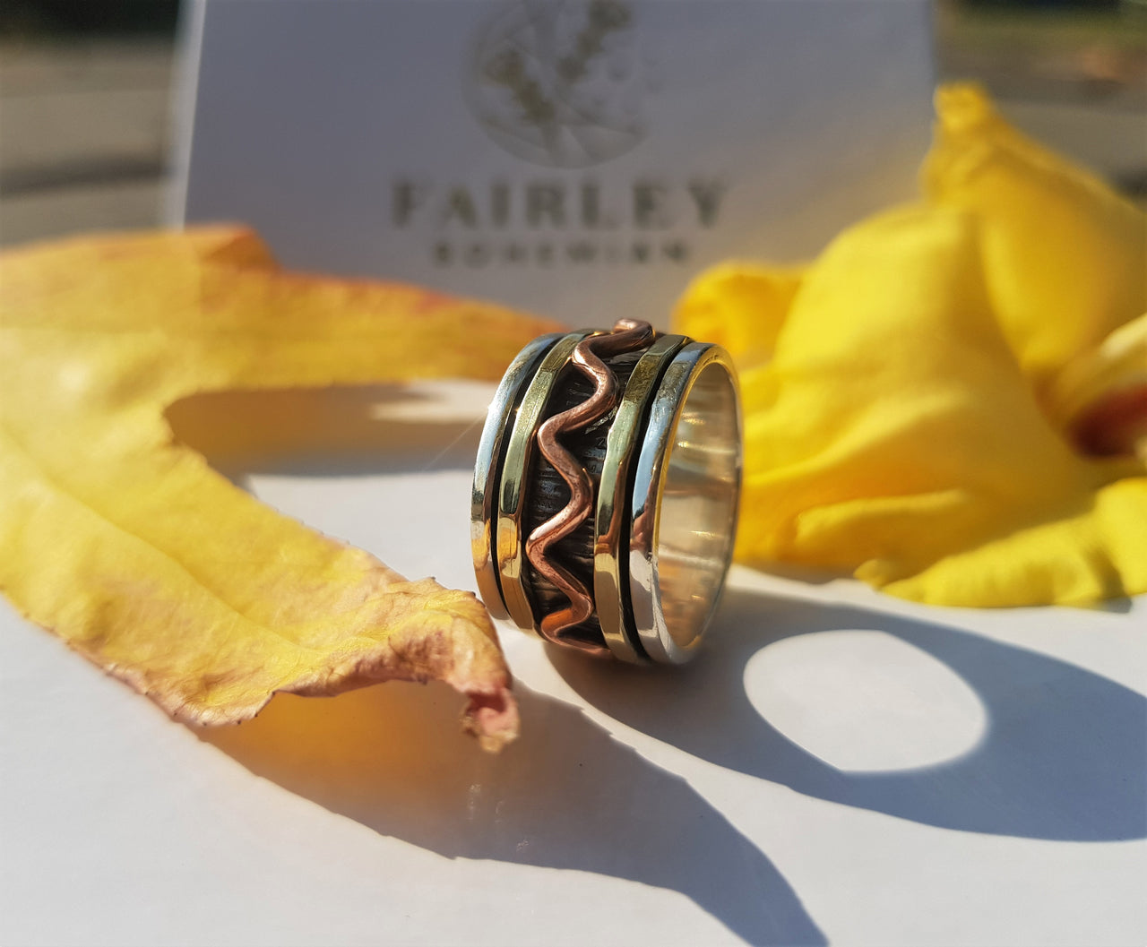 spinner ring with copper and brass spinning rings