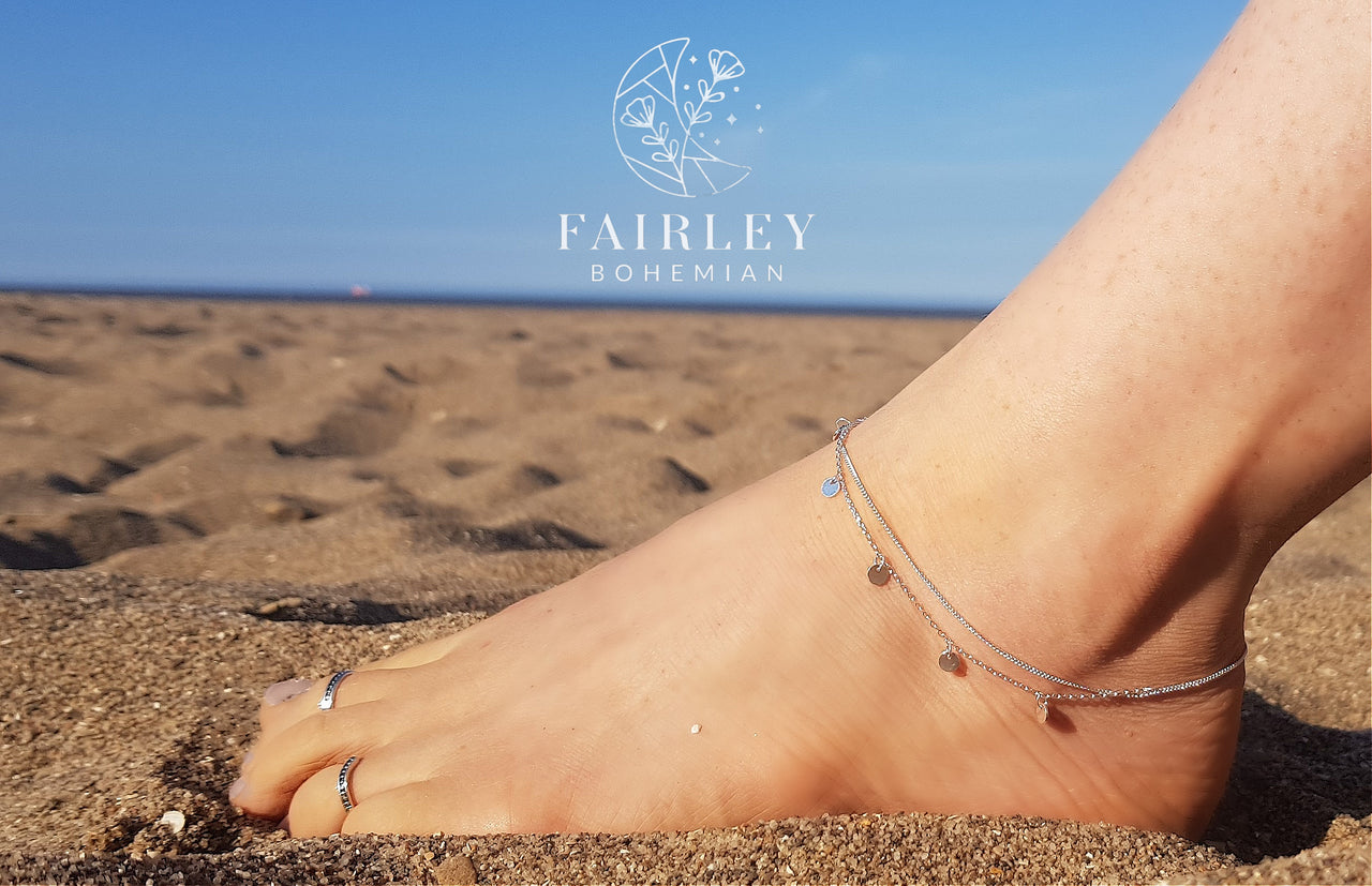 beautiful anklet on ankle model in the sun on the beach