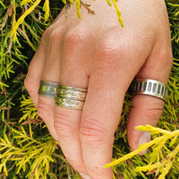 Thumbnail for The Ultimate Spinner Ring with boho rings on hand model in nature
