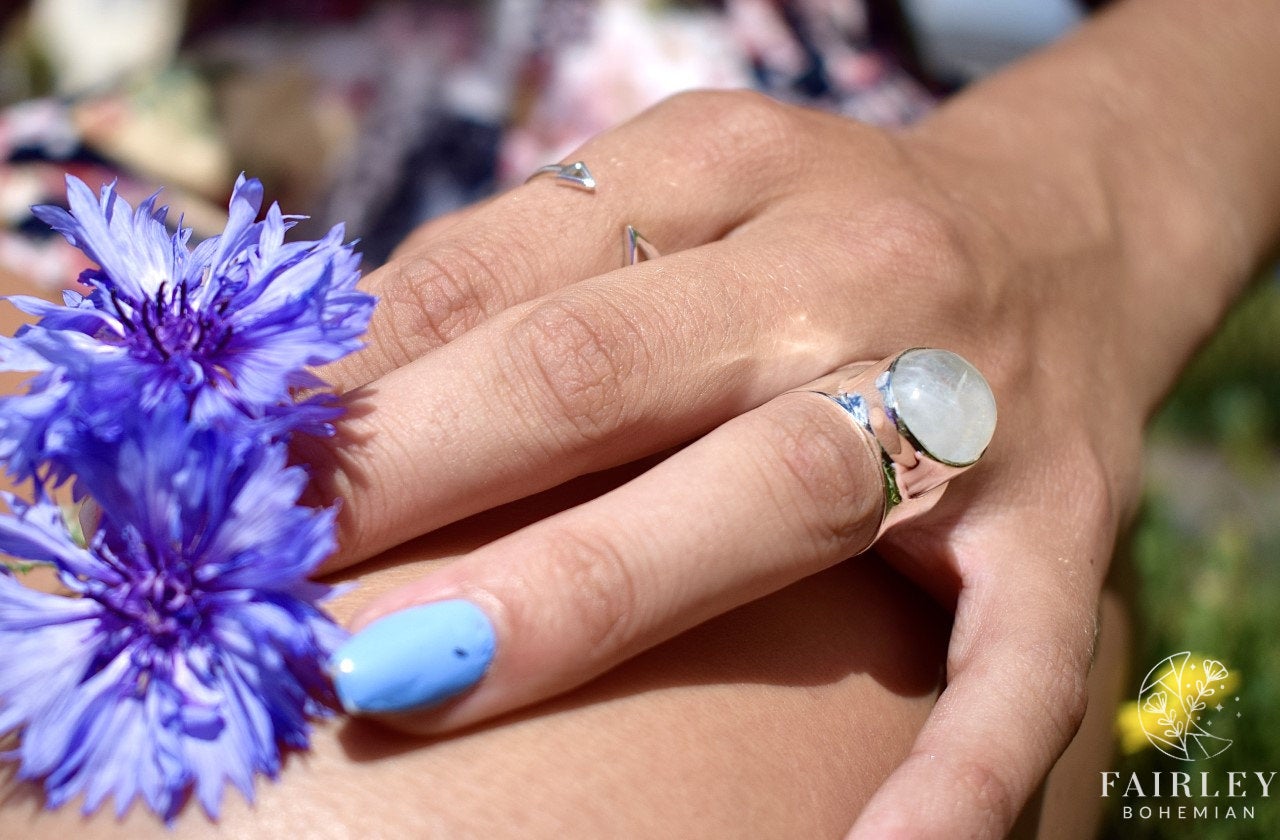 moonstone and arrow ring on hand model